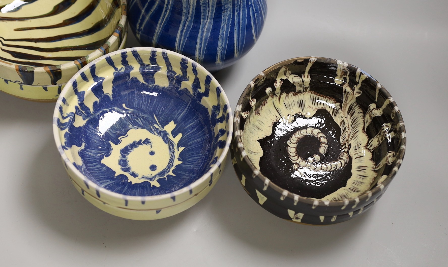 A group of six polychrome slipware bowls and a jug- 18cms high